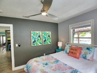 The SECOND BEDROOM has a cozy queen bed featuring a ceiling fan with plenty of storage in the roomy closet.