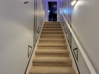 Stairway portal to the upstairs theme room