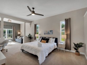 Master Bedroom with King size bed and queen sleeper sofa in the sitting area