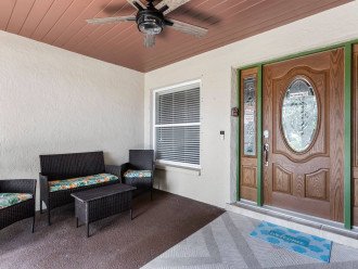 Enjoy watching the sunset at the entryway patio covered with a screened in porch.