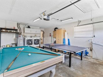 Entertainment space Air Conditioned AC in the garage comes with full size pool table and professional ping pong table separate from the living room space.