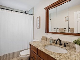 Bathroom 2 - The Guest bathroom features a large vanity, shower/bathtub, and bath essentials.