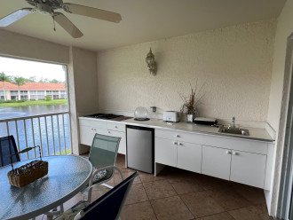 Outdoor kitchen- complete with electric BBQ, cooktop stove, fridge, sink