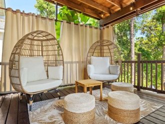 These cozy egg chairs on your private back porch are perfect for relaxing.