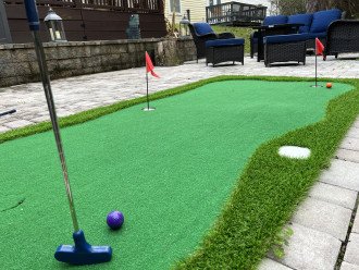 The mini-golf green in the backyard is perfect for some stay home entertainment