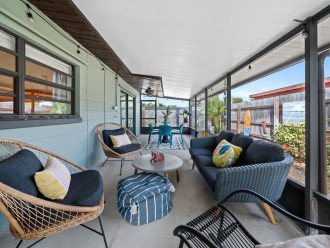 Conversation seating on screened patio.