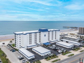 Surfside Club Condominium aerial view of building and oceanfront beach