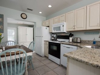 Kitchen has full size range/oven, refrigerator, dishwasher, and microwave,