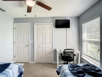 Twin bedroom with dedicated work space