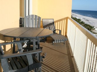 Balcony with Dining Table and Chaise Lounge