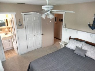 Master bedroom with adjustable queen bed and 1/2 bath