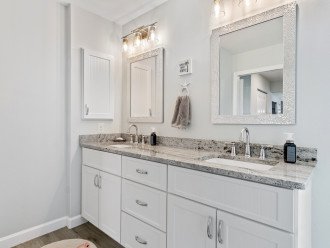 Large granite counter with dual sinks in master bath