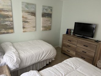 Two twin beds in second bedroom with brand new furniture in 2022