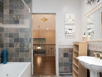 Spacious upstairs hallway bath with tub and shower
