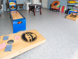 Need a tiny break from the sun? Enjoy the skee-ball, foosball table, and cornhole in the garage game room.