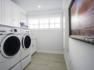 New washer and dryer with ironing board and iron