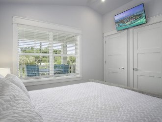 2nd floor bedroom with fan, Smart TV and closets