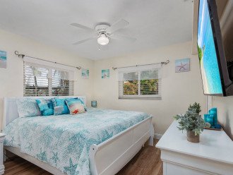 KING BED GUEST BEDROOM 2 (king bed, 65" smart TV, walk-in closet)***Garden view (Papayas, mangos, palm trees, hibiscus plants) as well as dock views***