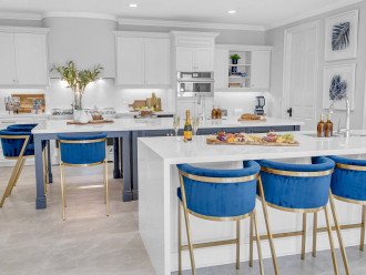 The kitchen is a chef's dream with plenty of space for cooking and preparation with plenty of seating space.