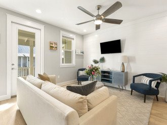 Enjoy the living room with easy balcony access and cable TV.