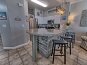 Spacious kitchen with new appliances and seating at the bar