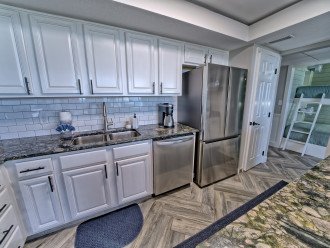 New stainless steel appliances, new subway tile and updated cabinets