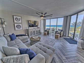 Living area has a new sleeper sofa, new smart tv and the most amazing views ever as well as beautiful modern coastal decor