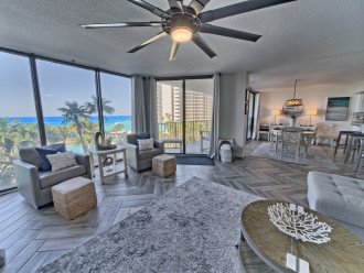 Enjoy the view of the lagoon pool and the Gulf of Mexico from the swivel chairs in the living room which has floor to ceiling windows