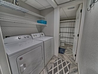 Full size washer and dryer located next to the 2nd bathroom