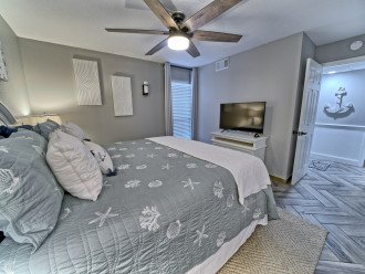 Jr master bedroom has a king bed, smart tv and connected to the 2nd bath