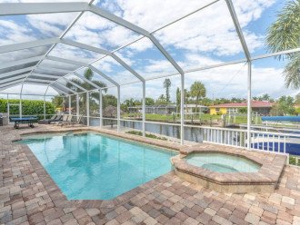 Large lanai area with heated saltwater pool and spa.
