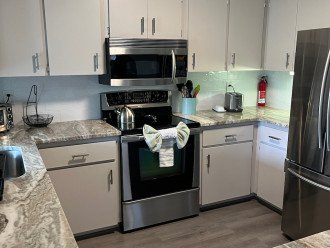 Kitchen includes drop coffee maker and Keurig coffee maker