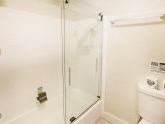 Bathroom with tub and shower combination.