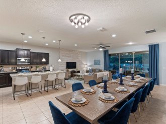 Our spacious open concept living, dining and kitchen space welcomes you upon arrival. It is designed with large groups in mind, with dining seating for ten, bar seating for four, ample living