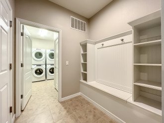 Our laundry room boasts two washer and two dryers to make laundry easy for large groups. The cubbies seen in the photos will have pool towels for your use.