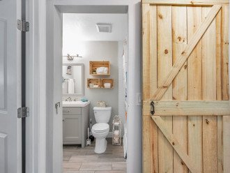 A Chic rustic barn door for the shared bathroom