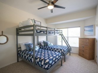Bunk Room with a full sized bed over two twin beds.