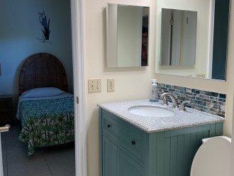 High vanities with deep sinks and stone counters make all bathroom tasks a breeze. Second bedroom WC shown.