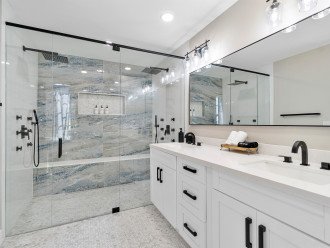 Master Bathroom #1 has dual rain showers fitted with marble tiling & 12 body jets!