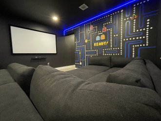 Sink in to the plush theatre seating while watching your favorite movies on the 92" projector screen!