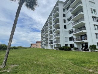 Corner unit steps out to grass yard for ease to beach, pool and play