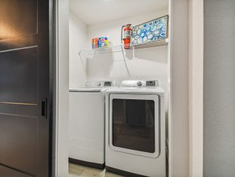 New Samsung washer and dryer with starter laundry products kit.