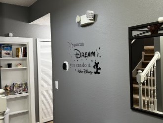 Entry way, featuring book/game shelf and Disney inspiration