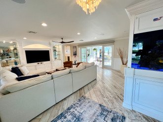 Living Room w/ French Doors & 150 gallon saltwater fish tank centerpiece