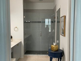 Newly updated shower large walk-in shower with bench