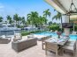 Waterfront tranquility from the lounge area and al fresco dinning, fire pit and outdoor TV.