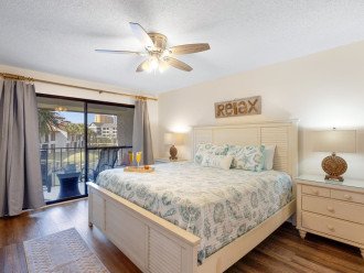 Master Bedroom offers a king bed, private en suite bath, tv & entrance to the balcony overlooking the lake.
