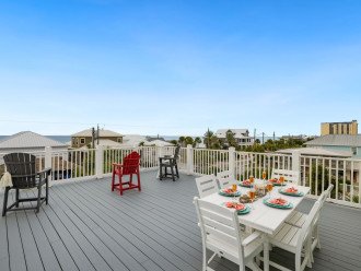 Roof top balcony with sitting space & peak a boo views of the Gulf of Mexico.
