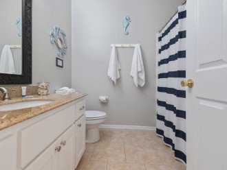 Hall bath on the upstairs level offers a full tub/shower combo.
