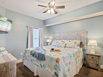Master bedroom offers a king bed, tv & master suite bathroom.